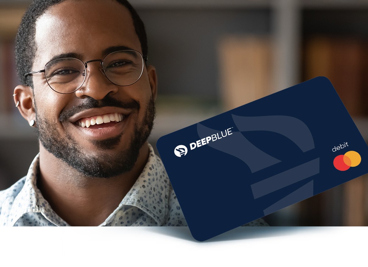 Man smiling with DeepBlue card